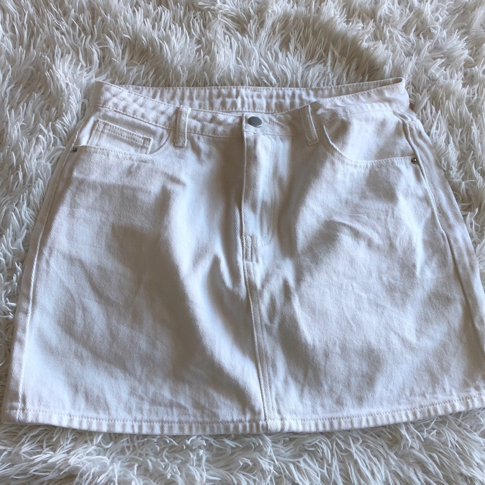 White Skirt, says HAPPY on back pocket